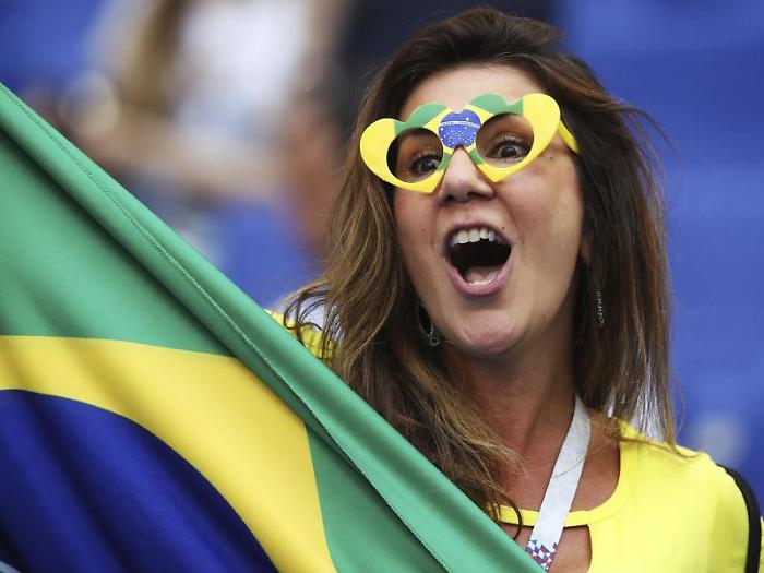 A Brazilian fan cheers prior the round of 16 match between Brazil and Mexico at the 2018 soccer World Cup in the Samara Arena, in Samara, Russia, Mon