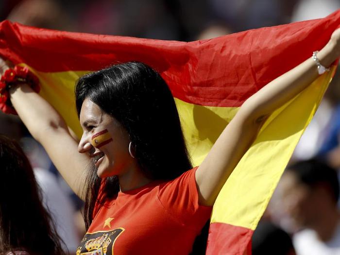 A Spain fan cheers prior to the round of 16 match between Spain and Russia at the 2018 soccer World Cup at the Luzhniki Stadium in Moscow, Russia, Su