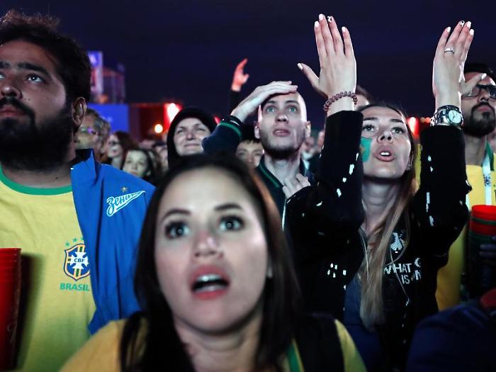 epa06869923 Brazilian supporters react while watching the broadcast of the FIFA 2018 World Cup quarter final match between Brazil and Belgium in the 