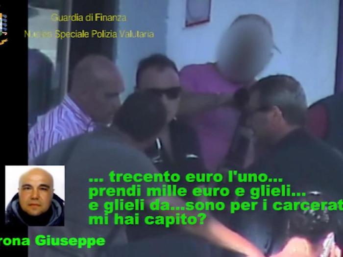 Un fermo immagine tratto da un video della guardia di finanza mostra un intercettazione ambientale durante l'operazione della Finanza che ha portato 