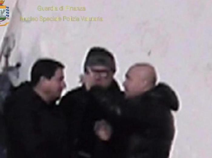 Un fermo immagine tratto da un video della guardia di finanza mostra un intercettazione ambientale durante l'operazione della Finanza che ha portato 