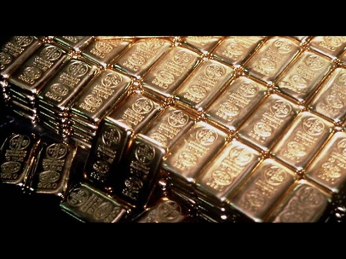 Oro frena, scende sotto 1.500 dollari