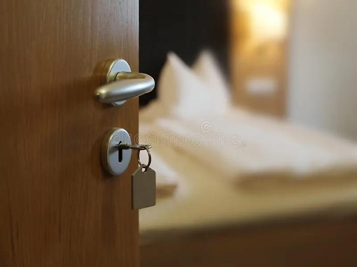 open-door-key-keyhole-hotel-room-157774680